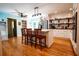 Spacious kitchen with central island, updated lighting, stainless appliances, and pantry at 5357 Highway 81, Loganville, GA 30052