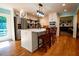 Bright kitchen with seating at the island and stainless steel refrigerator at 5357 Highway 81, Loganville, GA 30052