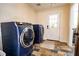 Laundry room featuring a washer and dryer and exterior door at 5357 Highway 81, Loganville, GA 30052