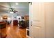 Open-concept living room with hardwood floors and sliding barn door at 5357 Highway 81, Loganville, GA 30052