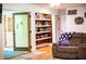Living room with built-in shelving and access to multiple rooms at 5357 Highway 81, Loganville, GA 30052