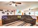 Spacious living room featuring hardwood floors and a comfortable sectional sofa at 5357 Highway 81, Loganville, GA 30052