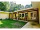 Inviting covered porch with rocking chairs and ceiling fans at 5357 Highway 81, Loganville, GA 30052