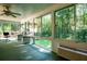 Bright sunroom with multiple windows overlooking lush backyard at 5357 Highway 81, Loganville, GA 30052