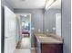 Bathroom featuring a granite countertop, well-lit vanity, and contemporary design at 860 Peachtree Ne St # 1806, Atlanta, GA 30308