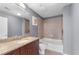 Bathroom with granite countertop, tile shower, and modern fixtures throughout at 860 Peachtree Ne St # 1806, Atlanta, GA 30308