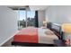 Well-lit bedroom with expansive windows, capturing a great city view at 860 Peachtree Ne St # 1806, Atlanta, GA 30308