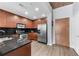 Cherry wood kitchen features stainless steel appliances, and a large double door refrigerator at 860 Peachtree Ne St # 1806, Atlanta, GA 30308