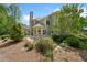 Landscaped backyard with pond and water feature provides a tranquil and inviting outdoor space at 295 River Laurel Way, Woodstock, GA 30188