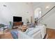 Spacious living room with hardwood floors, high ceilings, and a comfortable seating arrangement at 295 River Laurel Way, Woodstock, GA 30188