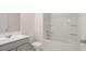 Bathroom with a single sink, toilet, and a tub with a shower at 320 Aspen Valley Dr, Loganville, GA 30052