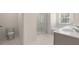 Well-lit bathroom featuring double sink vanity, marble floor, and large walk-in shower at 320 Aspen Valley Dr, Loganville, GA 30052