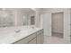 Beautiful primary bathroom with double vanity, a walk-in shower, and entry to the walk-in closet at 320 Aspen Valley Dr, Loganville, GA 30052