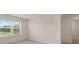 Bedroom with large window and plush carpet at 320 Aspen Valley Dr, Loganville, GA 30052