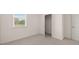 Bright bedroom featuring neutral carpet, a window, and closet at 320 Aspen Valley Dr, Loganville, GA 30052