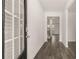 Welcoming entryway featuring a stylish front door and beautiful wood-look flooring at 320 Aspen Valley Dr, Loganville, GA 30052