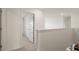 Upstairs hallway with doors leading to the bedrooms at 320 Aspen Valley Dr, Loganville, GA 30052