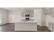 Spacious kitchen with a large island, stainless steel appliances, and ample cabinet space at 320 Aspen Valley Dr, Loganville, GA 30052