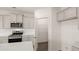 Modern kitchen featuring stainless appliances, granite countertops and a walk-in pantry at 320 Aspen Valley Dr, Loganville, GA 30052
