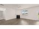 Living room boasts a fireplace, hardwood floors, and lots of natural light at 320 Aspen Valley Dr, Loganville, GA 30052