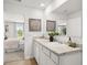 Bright bathroom offers double sinks, granite countertop, and a large mirror that reflects natural light at 414 Oak View Ln, Dallas, GA 30157