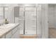 This bathroom features a glass shower, a vanity sink, and plenty of storage space at 414 Oak View Ln, Dallas, GA 30157