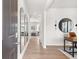 Bright entryway with wood floors, a hall mirror, and an open view into the living room at 414 Oak View Ln, Dallas, GA 30157