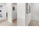 This hallway offers modern decor, wood plank floors, and natural light from a nearby window at 414 Oak View Ln, Dallas, GA 30157