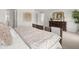This is a stylish main bedroom featuring a decorative dresser, plant, and warm color scheme at 414 Oak View Ln, Dallas, GA 30157