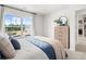 This main bedroom features a large window, stylish dresser, and natural light at 414 Oak View Ln, Dallas, GA 30157
