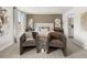 Comfortable main bedroom features stylish decor, cozy chairs, and lots of natural light from nearby windows at 414 Oak View Ln, Dallas, GA 30157