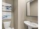 Elegant powder room featuring modern fixtures, a sleek sink, and stylish wall art at 414 Oak View Ln, Dallas, GA 30157