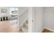 View of the staircase to the second floor along with the living area and a storage closet at 414 Oak View Ln, Dallas, GA 30157