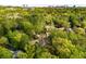 Aerial view of a neighborhood with mature trees and a view of the city skyline in the distance at 4201 Brookview Se Dr, Atlanta, GA 30339