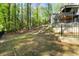 Expansive backyard with a gentle slope, surrounded by mature trees and lush greenery at 4201 Brookview Se Dr, Atlanta, GA 30339