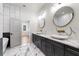 This primary bathroom features double sinks, marble countertops, and tile backsplash at 4201 Brookview Se Dr, Atlanta, GA 30339