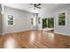 Bright bedroom with hardwood floors, three large windows, and a glass door to the balcony at 4201 Brookview Se Dr, Atlanta, GA 30339