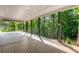 Expansive covered deck featuring wood flooring, metal railings, and string lights, ideal for entertaining at 4201 Brookview Se Dr, Atlanta, GA 30339