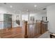 Upper-level hallway with hardwood flooring, wood and metal railings, and an open view of the floor below at 4201 Brookview Se Dr, Atlanta, GA 30339