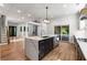 Stylish kitchen featuring a quartz island, stainless steel appliances, hardwood floors, and modern recessed lighting at 4201 Brookview Se Dr, Atlanta, GA 30339
