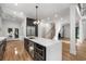 Open kitchen with an island, stainless steel appliances, custom cabinets, and access to other living spaces at 4201 Brookview Se Dr, Atlanta, GA 30339