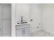 This laundry room includes a stainless steel sink and cabinet storage at 4201 Brookview Se Dr, Atlanta, GA 30339