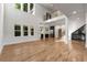Expansive living area with soaring ceilings, a balcony, large windows, and hardwood floors throughout at 4201 Brookview Se Dr, Atlanta, GA 30339