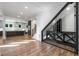 Open-concept living space featuring hardwood floors, a modern kitchen, and a glass-enclosed wine cellar at 4201 Brookview Se Dr, Atlanta, GA 30339