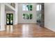 Bright living room boasts soaring ceilings, large windows, a striking fireplace, and gleaming hardwood floors at 4201 Brookview Se Dr, Atlanta, GA 30339