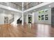 Bright, open living space with hardwood floors, a soaring two-story ceiling, and large windows offering verdant views at 4201 Brookview Se Dr, Atlanta, GA 30339