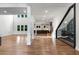 Spacious open-concept living room with gleaming hardwood floors, large windows, and a clear view of the gourmet kitchen at 4201 Brookview Se Dr, Atlanta, GA 30339