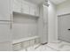 This mudroom features custom cabinets, built in bench and marble flooring at 4201 Brookview Se Dr, Atlanta, GA 30339