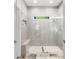 Walk-in shower featuring elegant tile work and a built-in bench at 4201 Brookview Se Dr, Atlanta, GA 30339