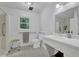 An accessible bathroom includes support bars, and a seat inside the shower at 5154 Meadowbrook Cir, Suwanee, GA 30024